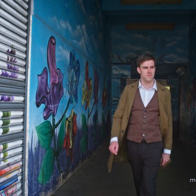 Philip Todd marches through the back streets of London